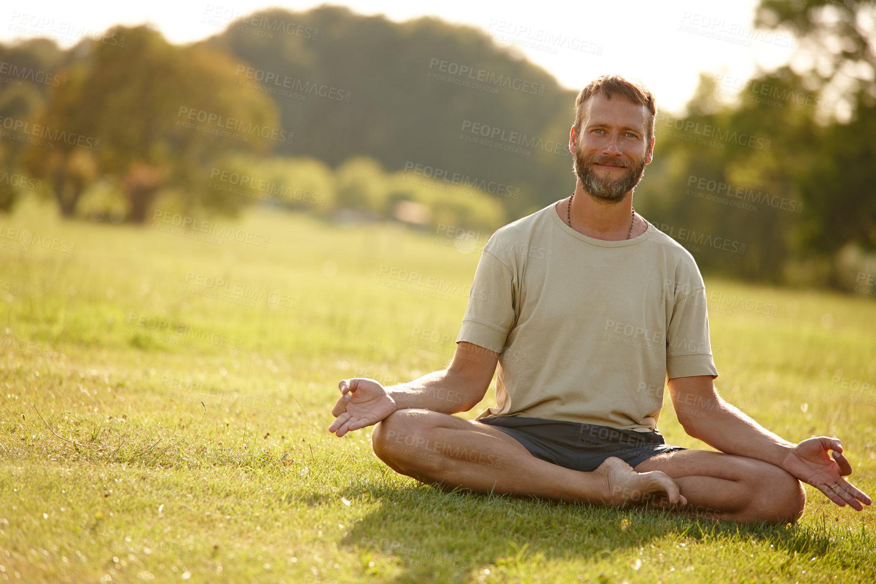 Buy stock photo Meditation, lotus pose and portrait of man in nature for relax, calm and grounding exercise in morning. Health, peaceful and male person in padmasana for outdoor flexibility, balance and mindfulness.