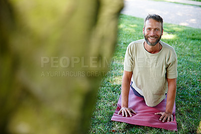 Buy stock photo Outdoor, man and portrait on yoga mat with stretching for fitness, exercise and workout in Germany. Male person, park and smile or happy on grass for self care, health and wellness as routine