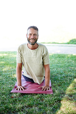 Buy stock photo Grass, man and portrait for yoga man with stretching for fitness, exercise and workout in Germany. Male person, outdoor and smile or happy at park for self care, health and wellness as routine