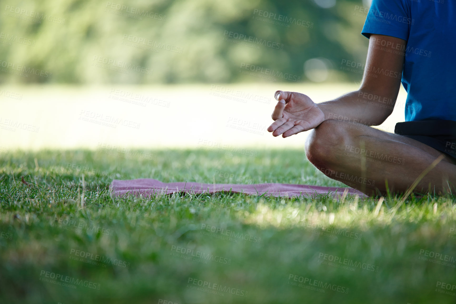 Buy stock photo Outdoor, hands and man for mediation on mat with mindfulness, peace and calm for mental health. Male person, grass and lotus pose at park on zen for spirituality, relax and self care or stress relief