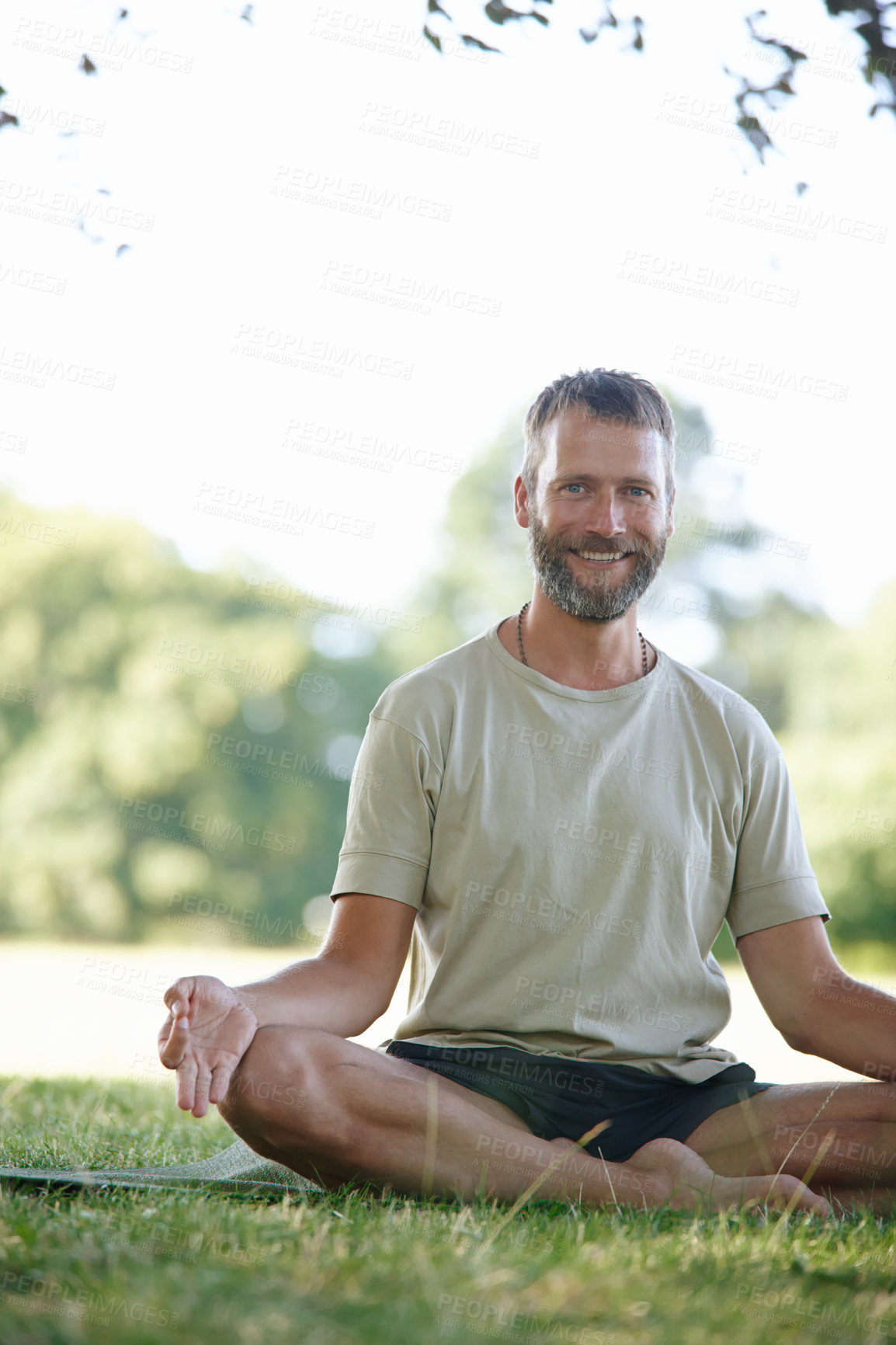 Buy stock photo Portrait, relax and man in park, meditation and smile with wellness, morning routine and lotus. Face, person and guy with exercise, outdoor and yoga with break, calm and chakra with fitness or nature