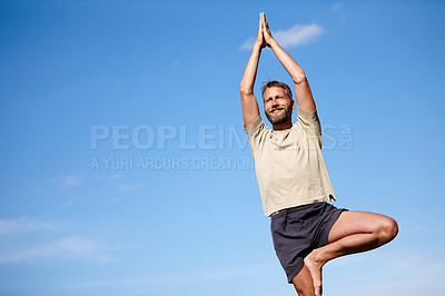 Buy stock photo Yoga, outdoor and mature man with tree pose for exercise, stretching or fitness. Smile, yogi and calm with prayer hands for holistic health, body wellness and relax for peace by mockup space on sky