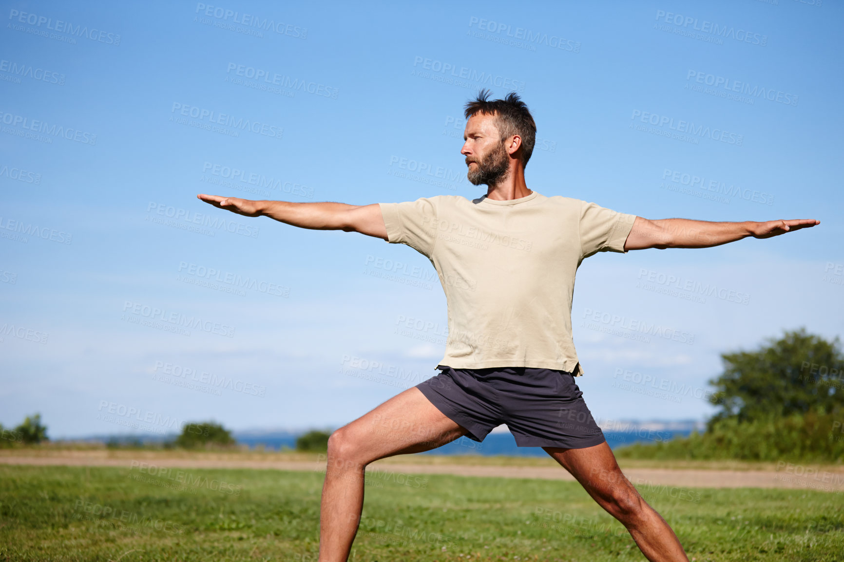 Buy stock photo Nature, man and stretching on grass with yoga for exercise, balance or mobility at park. Pilates, mature yogi and warrior pose on lawn for workout, holistic wellness or posture with fitness on mockup