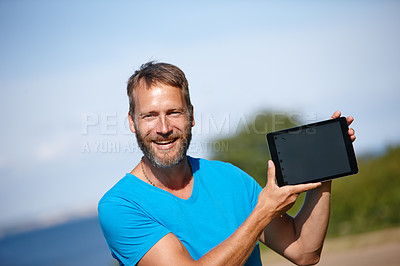 Buy stock photo Happy man, portrait and nature with tablet screen for marketing, advertising or outdoor app. Mature, male person or yogi with smile or technology display for tutorial, health tips or mockup at park