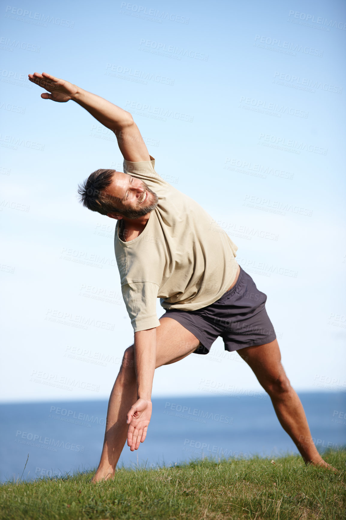 Buy stock photo Nature, yoga and happy man stretching body for flexibility, wellness and holistic health with calm soul. Relax, smile and male person in park for mindfulness, chakra balance or peace with awareness