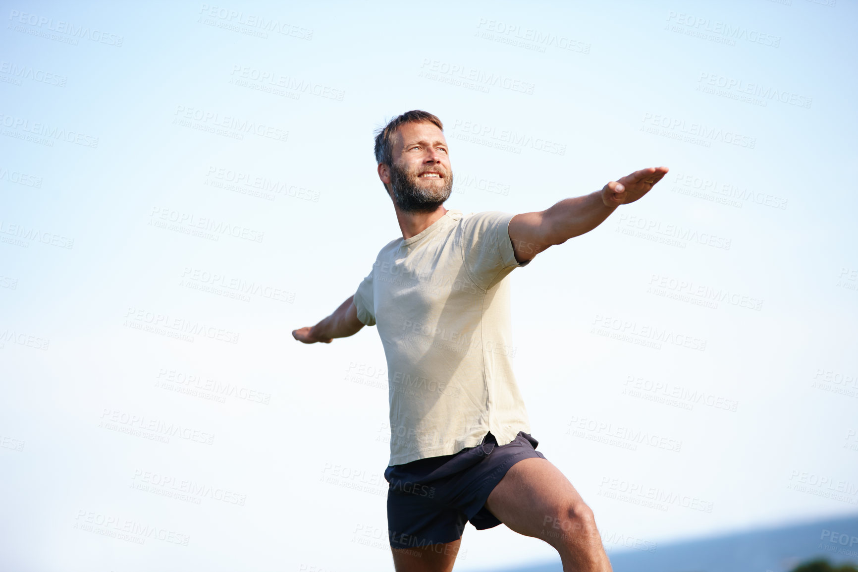 Buy stock photo Nature, yoga and man in warrior pose for flexibility, wellness and holistic health for calm soul. Relax, smile or person stretching arms in park for mindfulness, chakra balance or peace for awareness