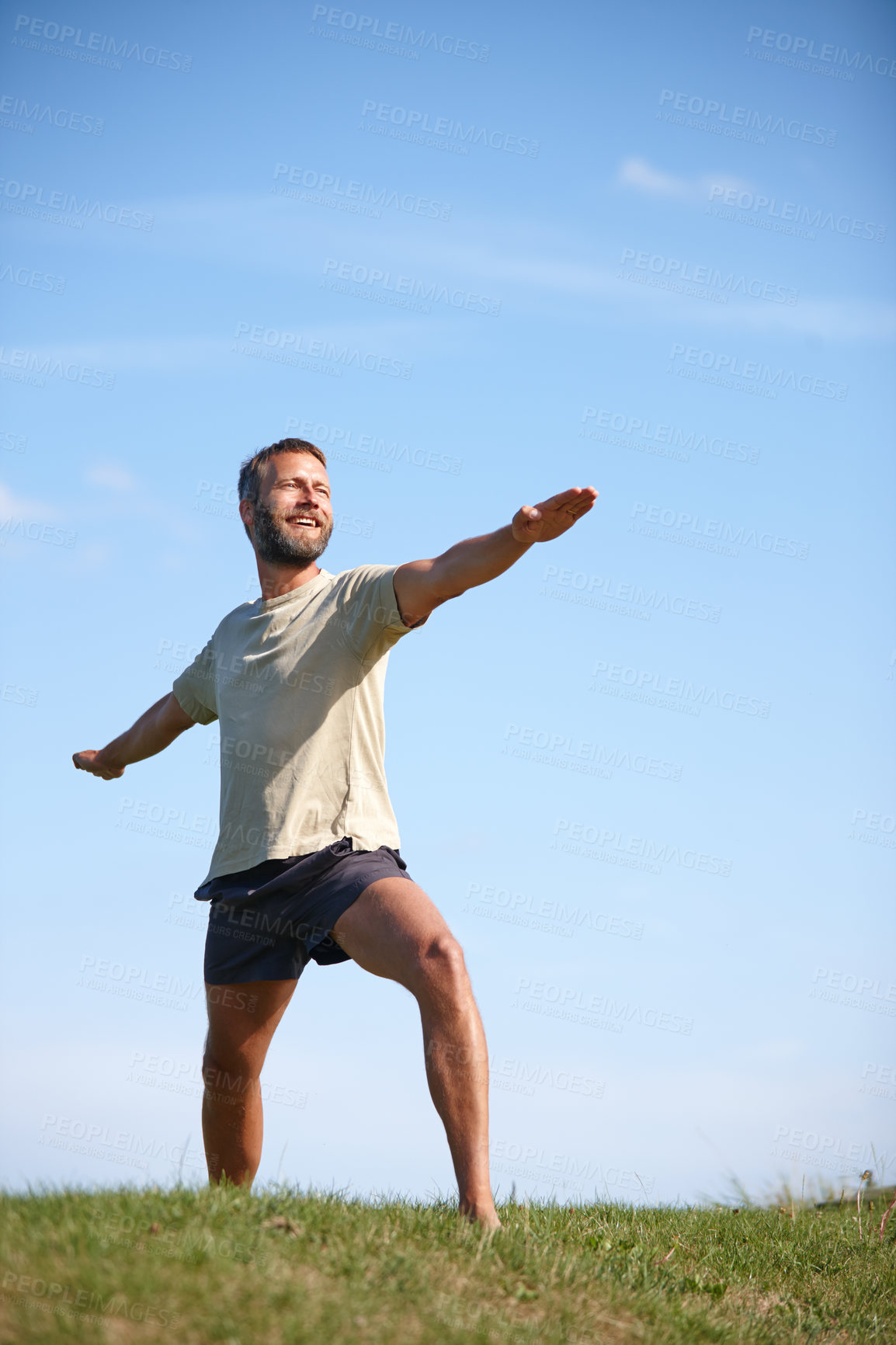 Buy stock photo Smile, man and stretching outdoor with yoga for exercise, balance and mobility in nature. Pilates, mature yogi and warrior pose on grass for workout, holistic wellness and posture with fitness mockup