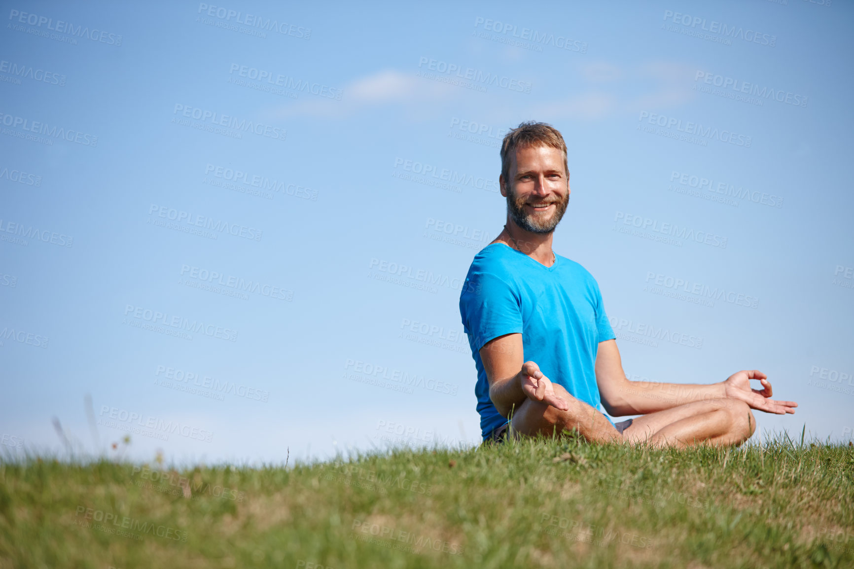 Buy stock photo Portrait, lotus and man on grass for meditation, mockup space and holistic health with calm soul. Sit, nature and zen yogi in park for mindfulness, chakra balance or peace with awareness or fresh air