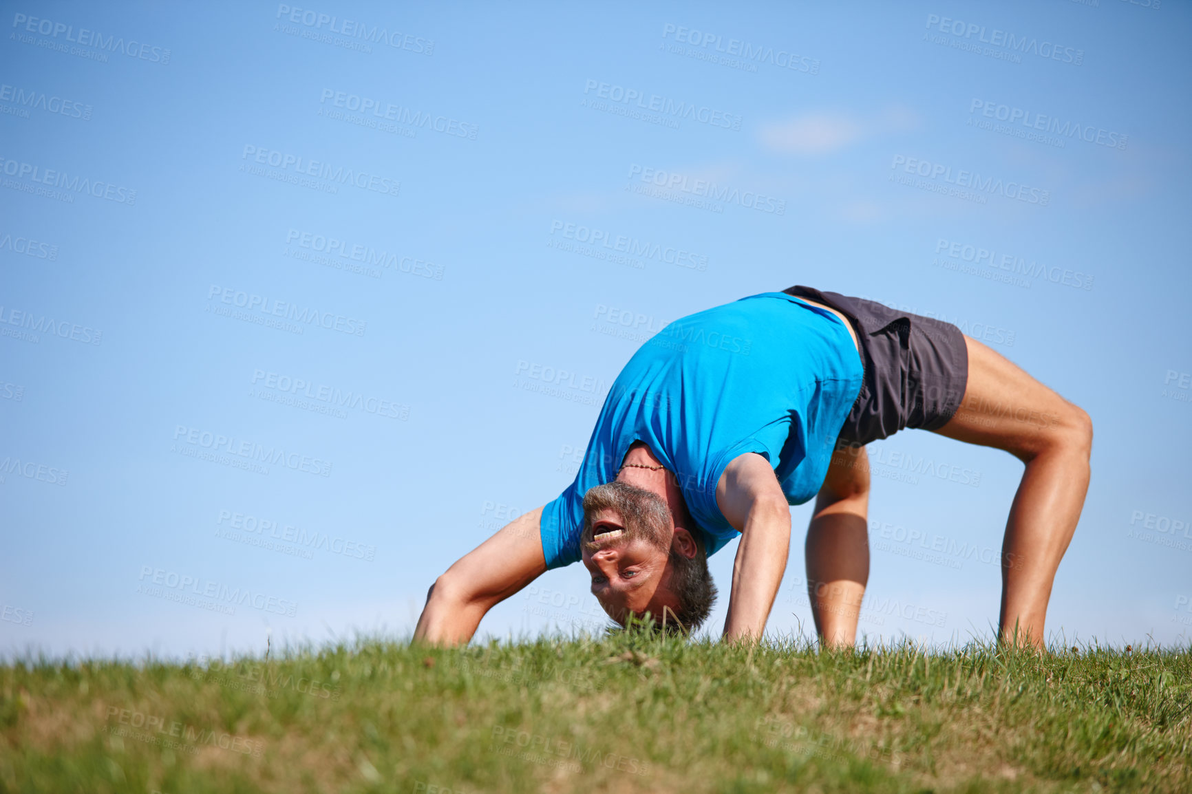 Buy stock photo Smile, man and stretching on grass for yoga exercise, flexible body and spiritual wellness of performance. Happy, male person and warm up with chakra peace, mindfulness healing and fitness outdoor