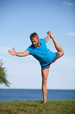 Buy stock photo Yoga, stretching and man in nature, outdoor and fitness with balance, wellness and exercise in park. Workout, health and relax with warm up, posture and activity for person, flexibility and mockup