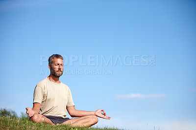 Buy stock photo Yoga, meditation and man with lotus on grass for breathing exercise, mindfulness or zen for holistic fitness. Mature, yogi or pose for health, body wellness or relax for peace on mockup space outdoor