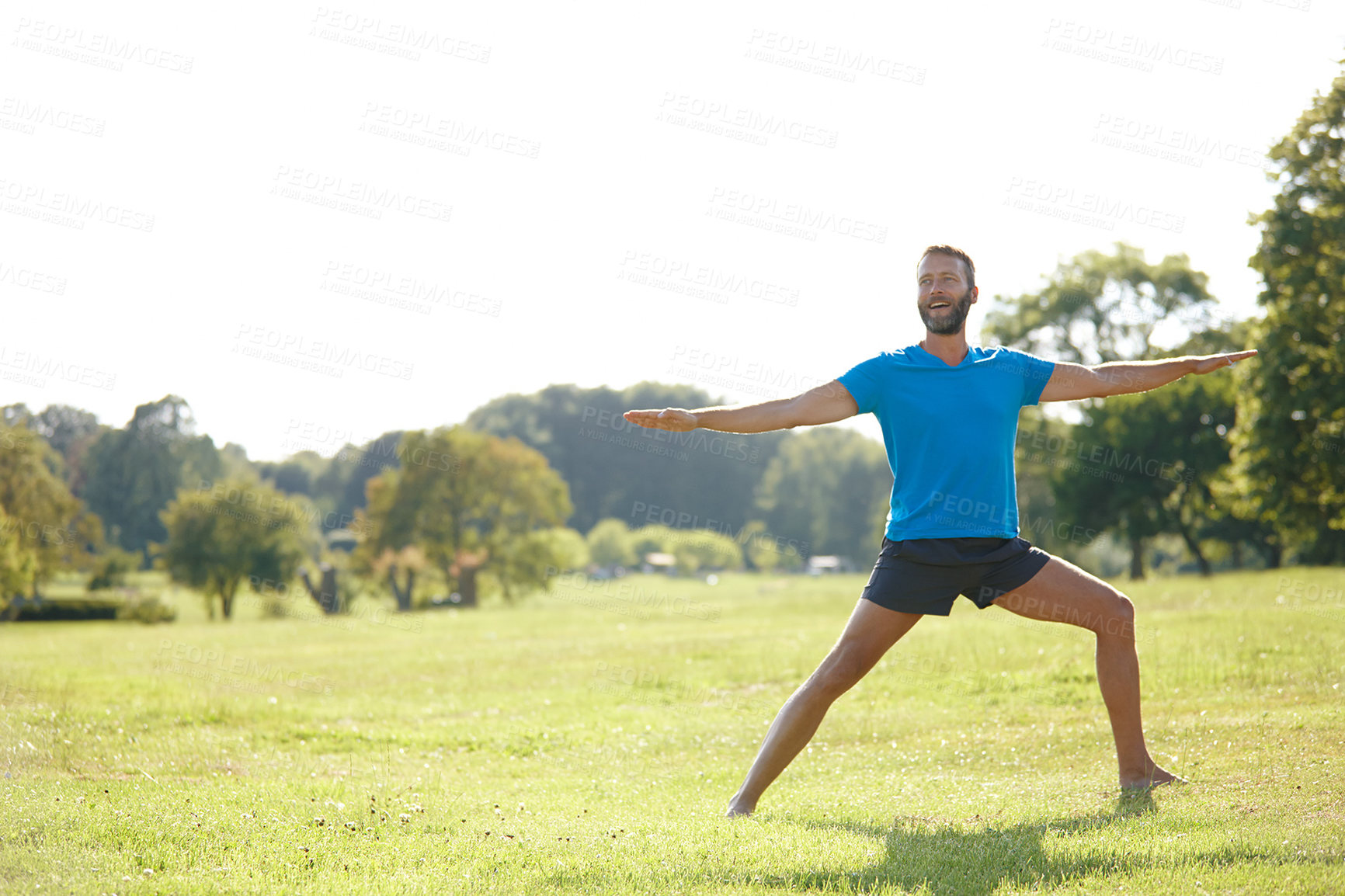 Buy stock photo Park, man and happy with stretching for fitness, exercise and workout in Germany. Male person, outdoor and smile or satisfied on grass at forest for self care, health and wellness as routine