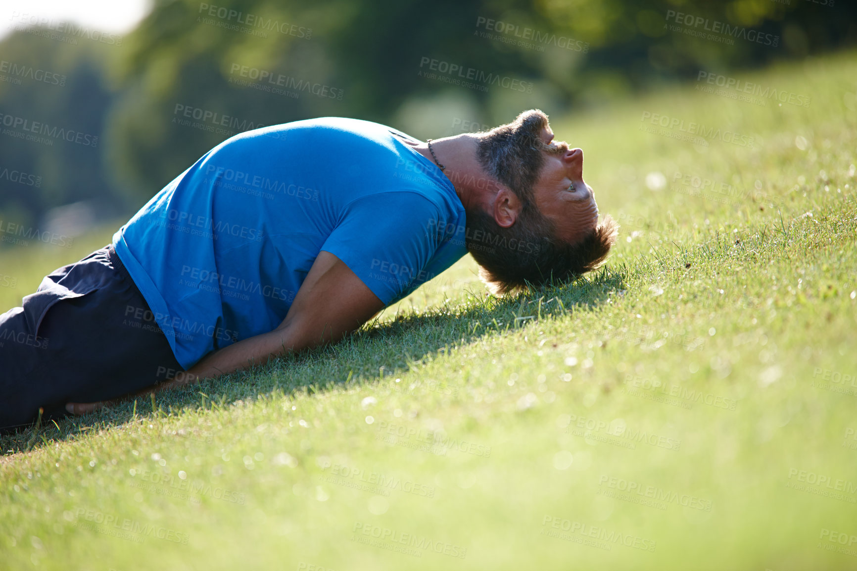 Buy stock photo Man, stretching and yoga in nature for fitness, health and back muscle in morning on green grass. Male person, field and activity outdoor for flexible exercise, workout and training with challenge