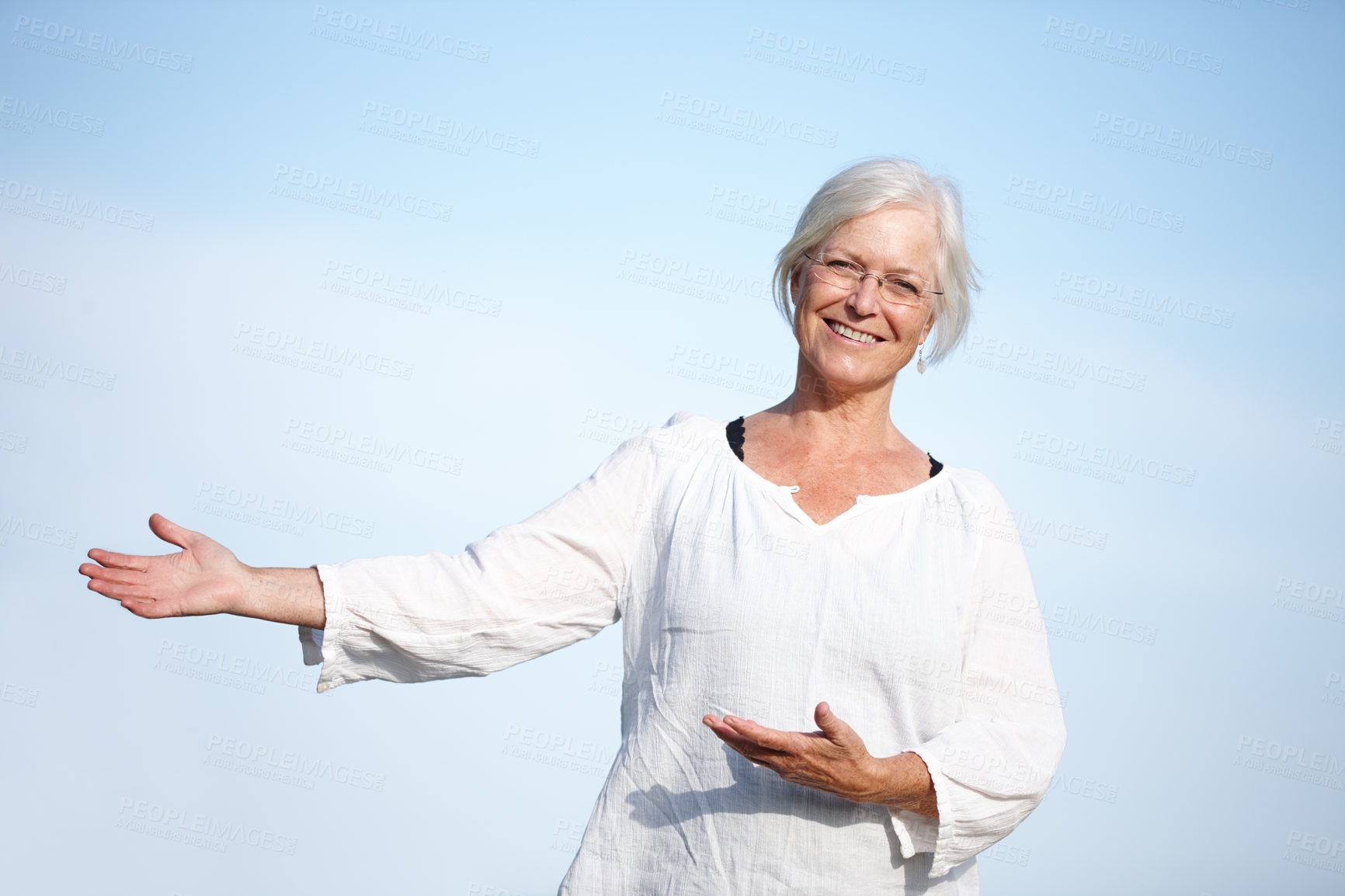 Buy stock photo Senior, woman and portrait with advertising for promotion on blue sky mockup space. Mature, person and show product placement for presentation, information and happy with retirement plan opportunity