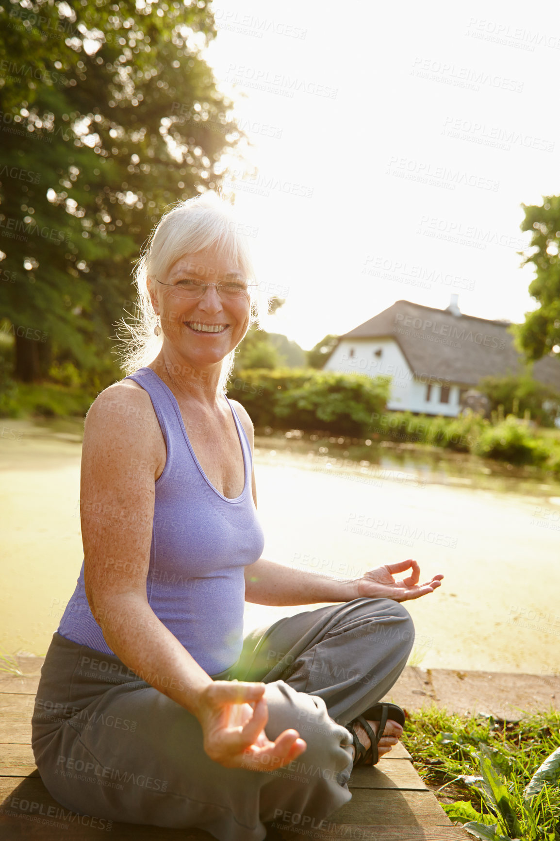 Buy stock photo Senior woman, outdoor and portrait for yoga, meditation and mindfulness for healing chakra. Female person, river view and holistic pose for spiritual awareness, morning fitness and peace in exercise