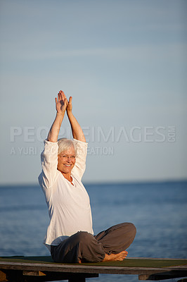 Buy stock photo Mature woman, portrait or yoga with meditation by lake for exercise, workout or holistic balance in nature. Senior, female person or yogi with smile for training, health or wellness by beach or ocean