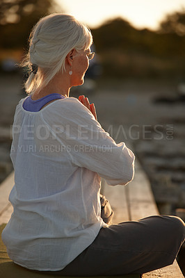 Buy stock photo Outdoor, mature woman and namaste for meditation with peace, calm and spiritual for mental health.Female person, serious and zen on break with hobby or activity for self care, wellbeing and relax