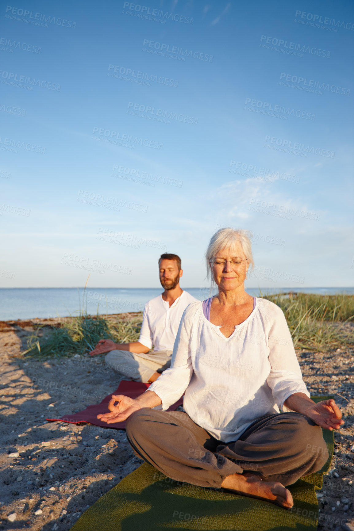 Buy stock photo Couple, fitness and meditation of yoga by ocean with holistic care, spiritual wellness and mindfulness zen. Mature people, chakra and pilates peace, mindset healing and performance of morning outdoor