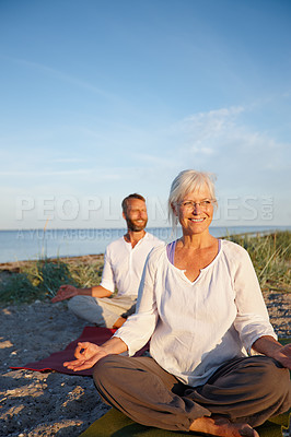 Buy stock photo People, lotus or yoga class at beach for peace, wellness or holistic activity for mental health. Mature pilates group, happy or zen posture on sand for balance, fitness session or breathing exercise