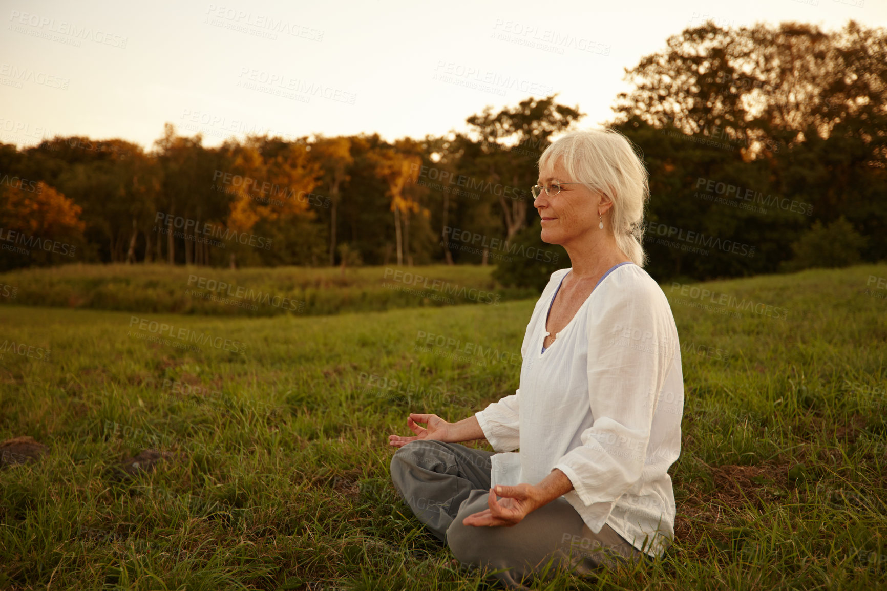 Buy stock photo Relax, lotus pose and woman in nature for meditation, calm and grounding exercise in morning. Health, peaceful and senior female person in padmasana for outdoor flexibility, balance and mindfulness.