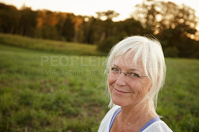 Buy stock photo Smile, nature and portrait of senior woman with confidence for retirement, vacation and outdoor exploring. Happy, mature person and relax in New York park for holiday, tourism and health or wellness