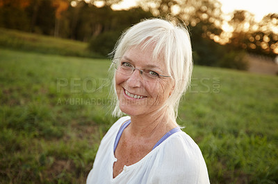 Buy stock photo Smile, happy and portrait of senior woman with confidence for retirement, vacation and outdoor exploring. Nature, mature person and relax in New York park for holiday, tourism and health or wellness