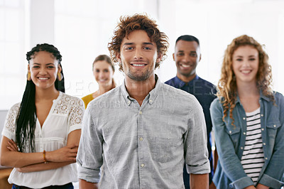 Buy stock photo Cropped portrait of a group of young coworkers standing in a brightly lit office