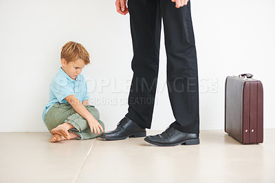 Buy stock photo Sad, child and businessman to leave for work, anxiety and tantrum, stop dad for care, support and love. Father, mental health or kid stress on floor for help, professional and headache or depression