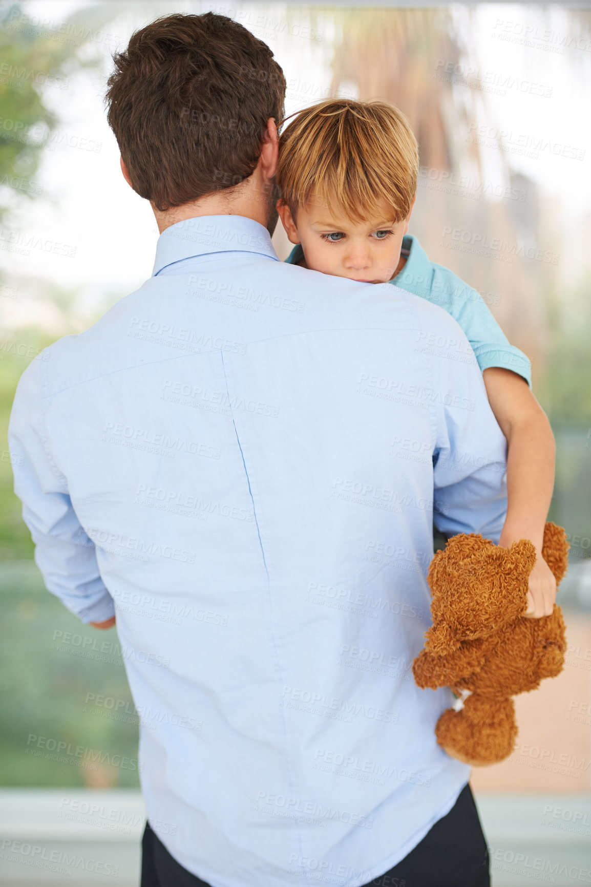 Buy stock photo A little boy is upset that his father is leaving for work