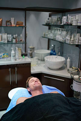 Buy stock photo Shot of a man lying on a table in a beauty clinic