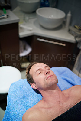 Buy stock photo Shot of a man lying on a table in a beauty clinic