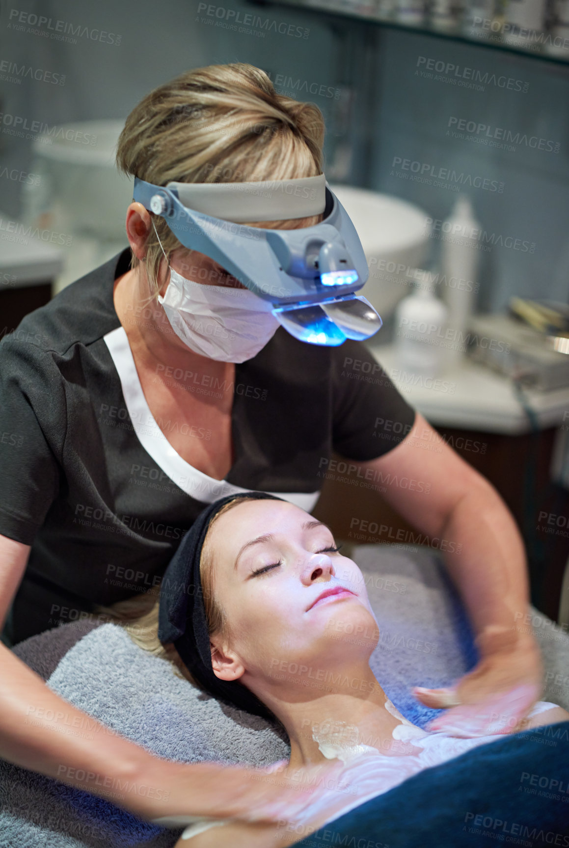 Buy stock photo Shot of a woman getting a skincare treatment at a clinic