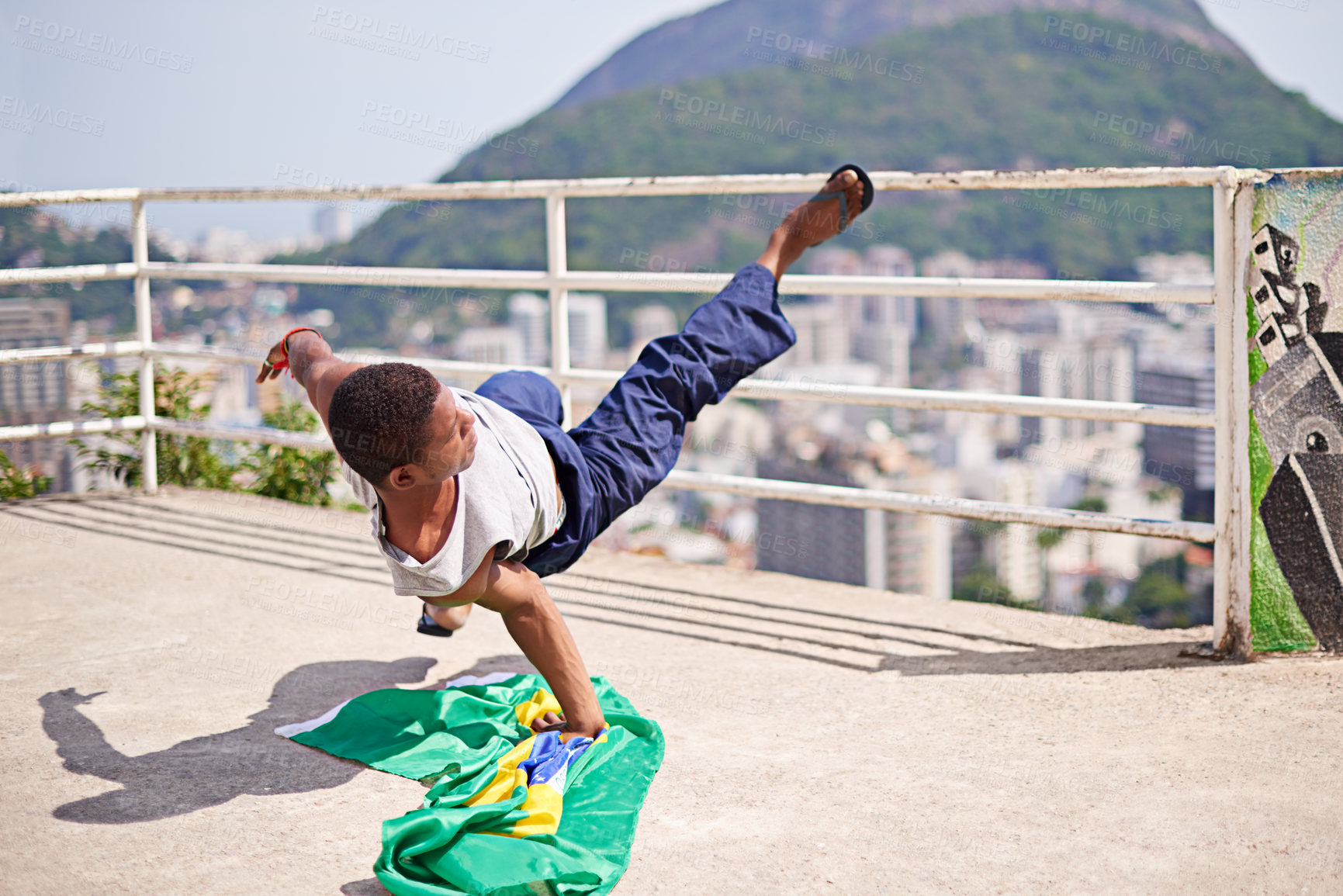 Buy stock photo Shot of a young male breakdancer in an urban setting