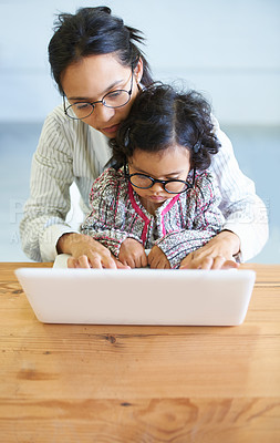Buy stock photo Remote work, typing and a mother with a child and a laptop for communication, email or connection. House, care and a woman with a girl kid and a computer for freelance, entrepreneur or a web job