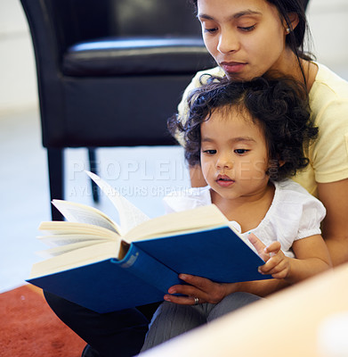 Buy stock photo Mother, child and book reading in home for storytelling, childhood development or education learning. Little girl, woman and knowledge talk or information growth, fantasy imagine or bonding together