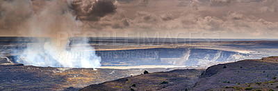 Buy stock photo The geology of the largest volcano in Mauna Loa on overcast sky. Landscape of smoky mountain in a secluded location on Big Island, Hawaii. A steaming volcanic area with smoke coming out of the crater