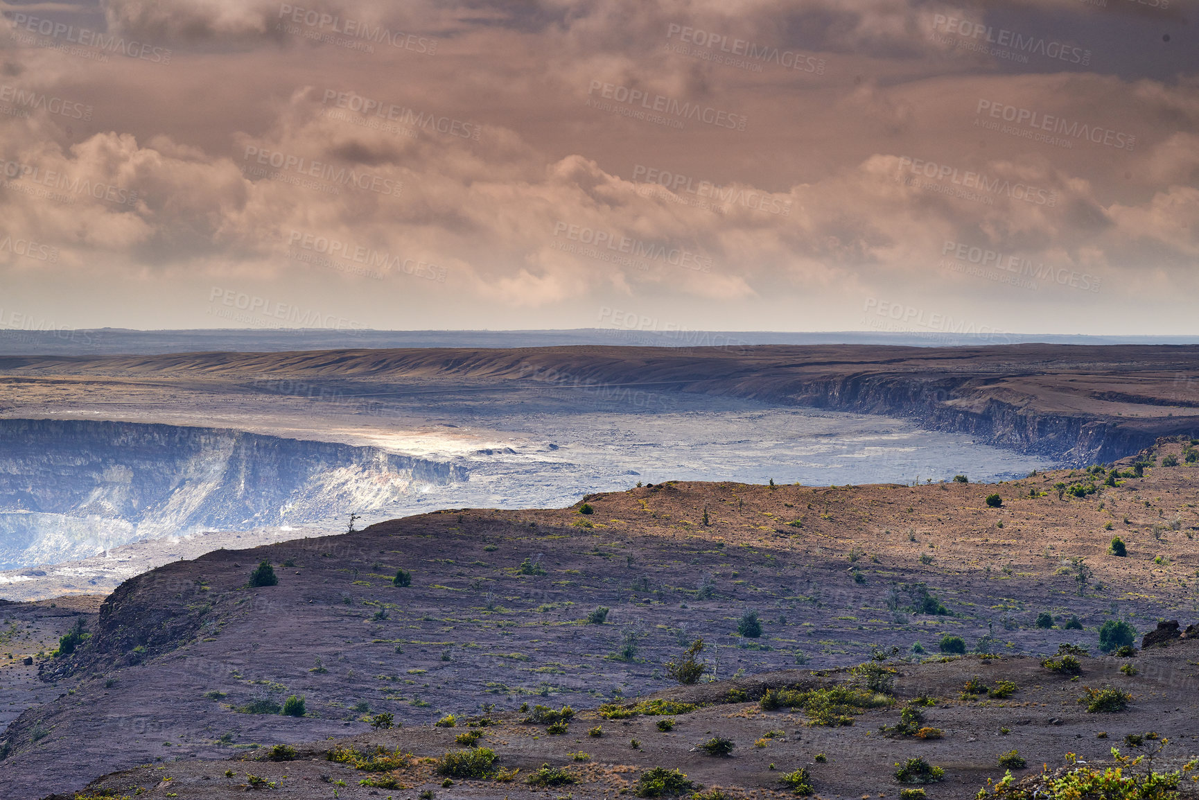 Buy stock photo Landscape of cooled lava flow on Big Island of Hawaii. Scenic view of Mauna Kea, a dormant volcano in a remote area with copy space. Vast expanse of nature and cloudy sky near summit of volcanic land