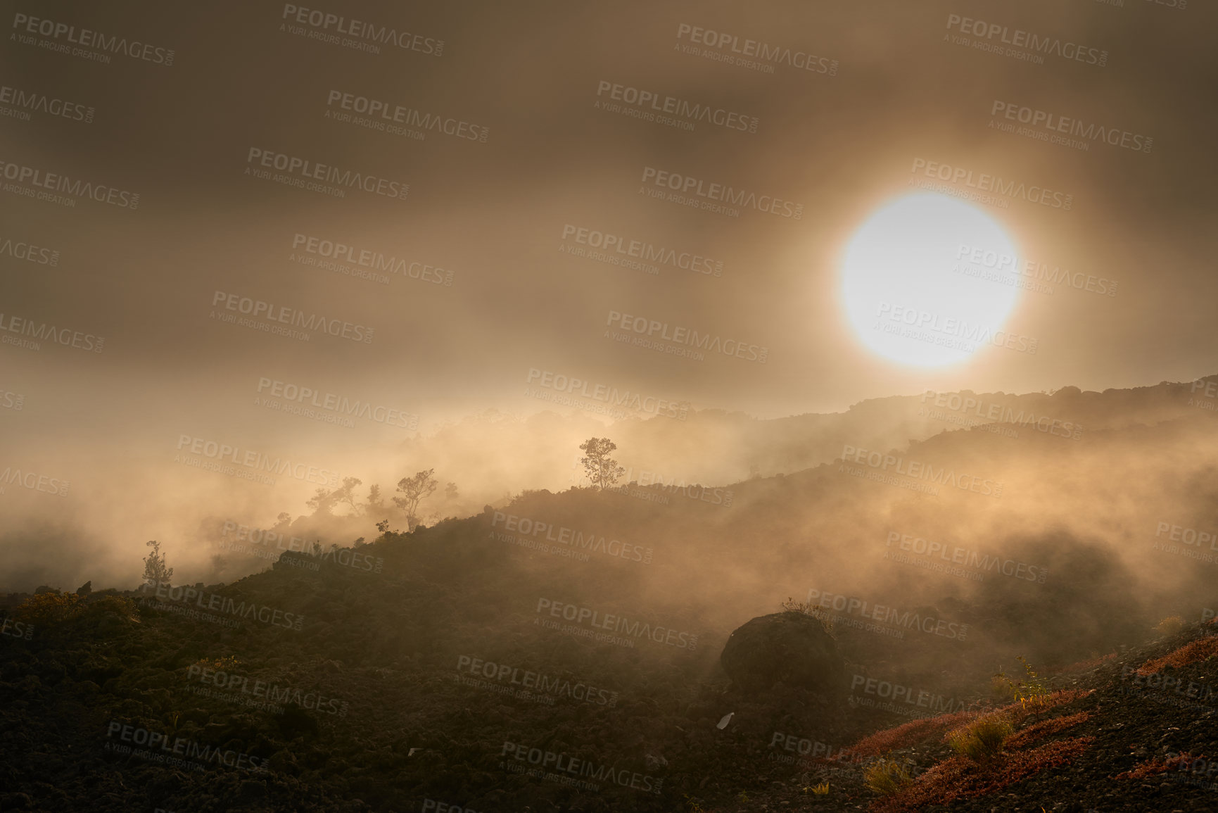 Buy stock photo Landscape of misty mountain on Big Island, Hawaii. Scenic view of Mauna Kea, dormant volcano in remote area with copyspace. Vast expanse of nature and foggy sky near summit of volcanic land at sunset