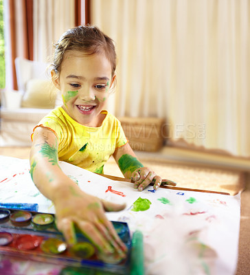Buy stock photo Finger painting, creative and girl kid with homework, assignment or project for school at home. Colorful, art and young student creating on paper for hobby, child development or activity at house.