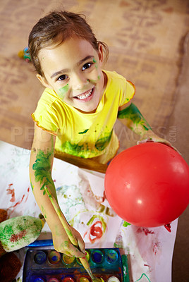Buy stock photo Shot of an adorable little girl making a mess while painting