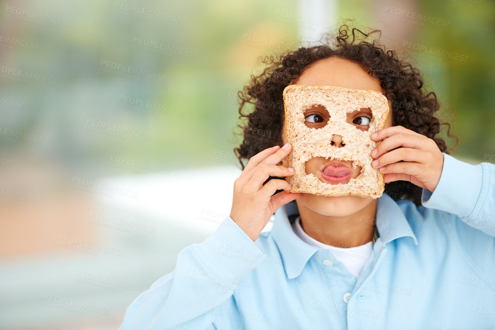 Buy stock photo Child, funny or face food mask or bread play, nutrition hungry or eating health value. Boy, tongue or brown diet fibre for kid vitality cooking or meal prep dinner humor for snack, lunch or comedy