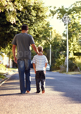 Buy stock photo Back view, father and kid walking on street together for bonding, support and love on vacation or holiday in summer. Care, talking and dad on road with child in neighborhood on weekend as parent