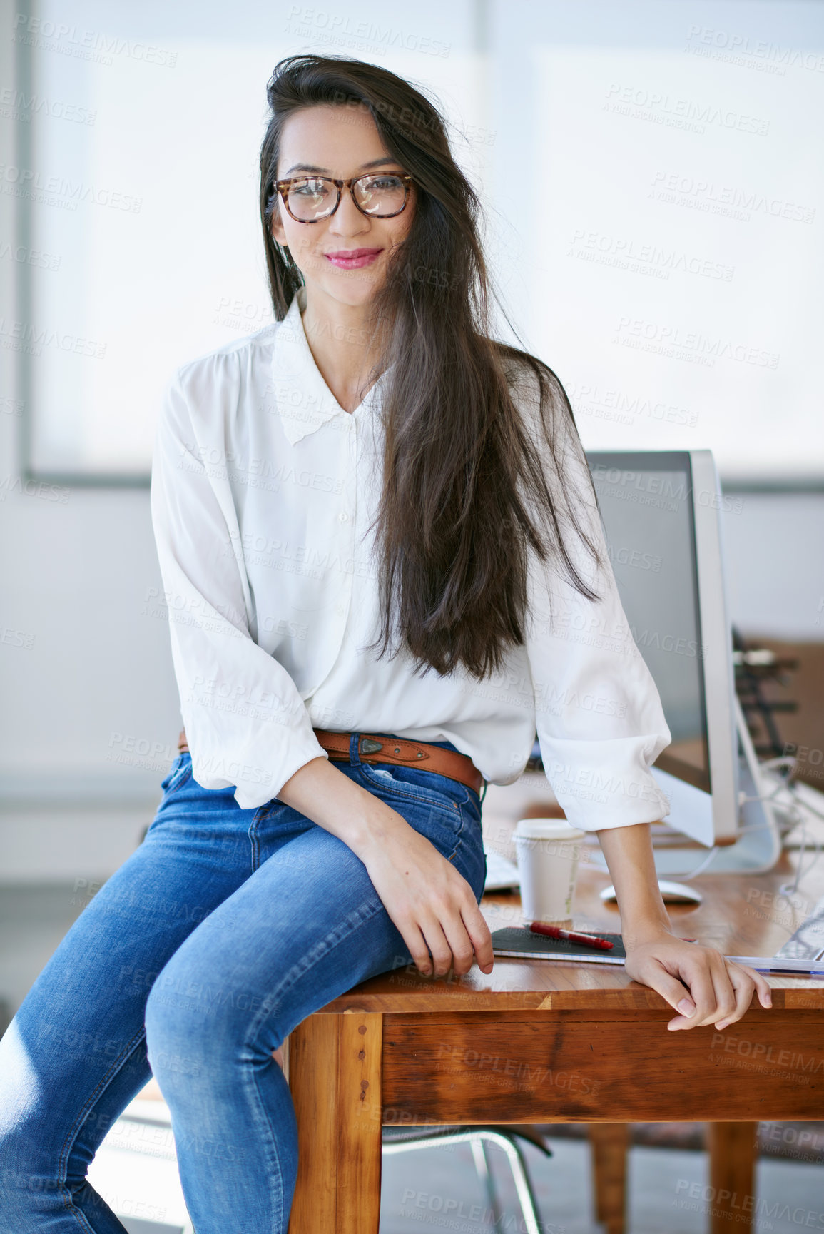 Buy stock photo Shot of a beautiful young woman working in a modern office