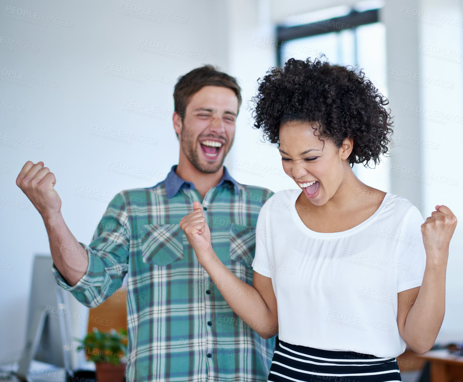 Buy stock photo Shot of a excited coworkers cheering in an office