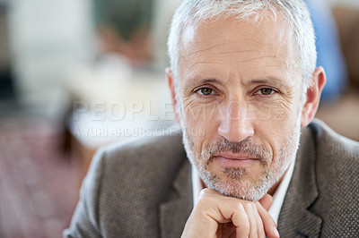 Buy stock photo Portrait of a mature businessman sitting in an office