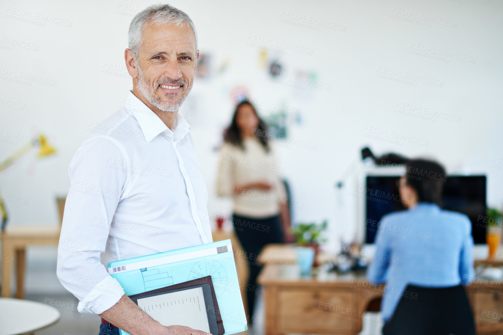 Buy stock photo Portrait of a mature businessman standing in an office