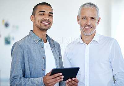 Buy stock photo Portrait of two business colleagues standing in an office