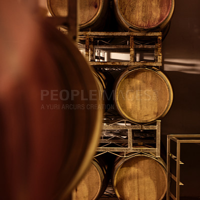 Buy stock photo Cropped shot of a wine barrels in a storehouse
