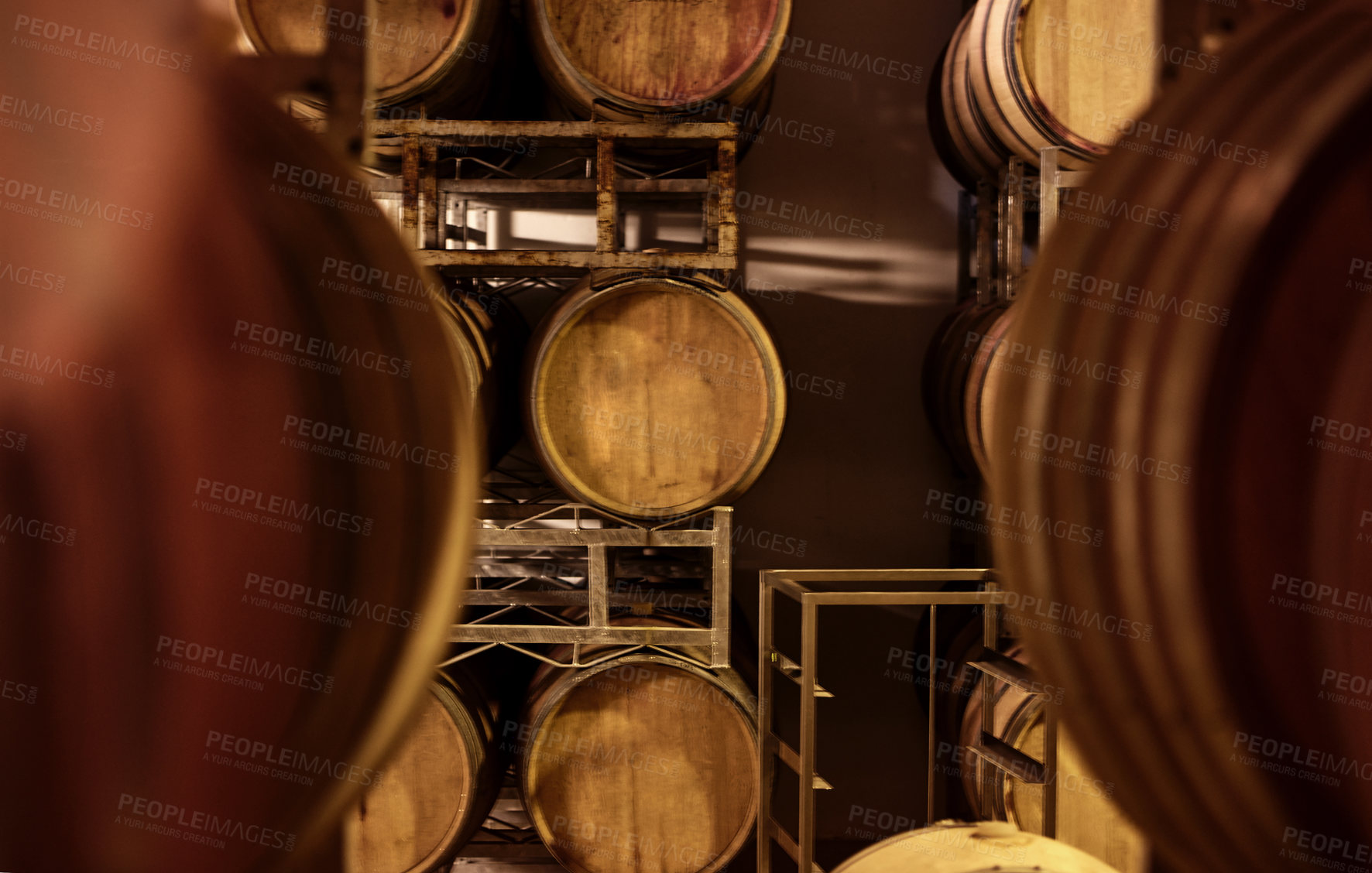 Buy stock photo Cropped shot of a wine barrels in a storehouse