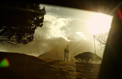 Buy stock photo A sunset behind cloudy mountains